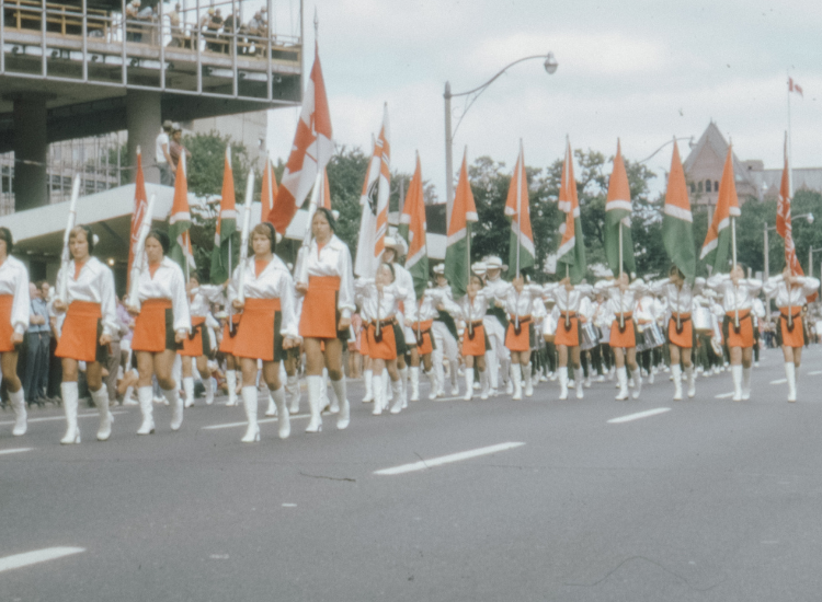 A group of women wear Go-Go boots during a parade in the 1960s